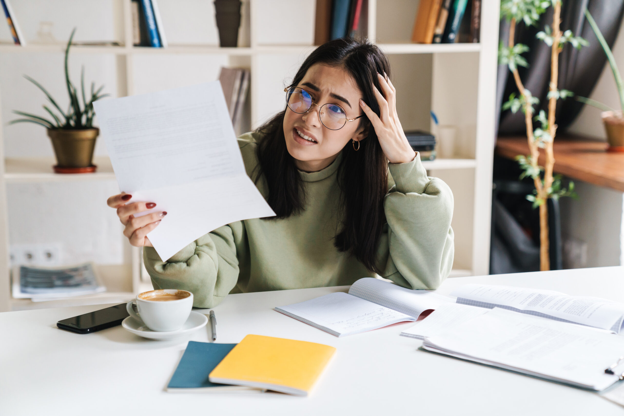 Person frustrated while reviewing legal documents, representing common mistakes in personal injury lawsuits
