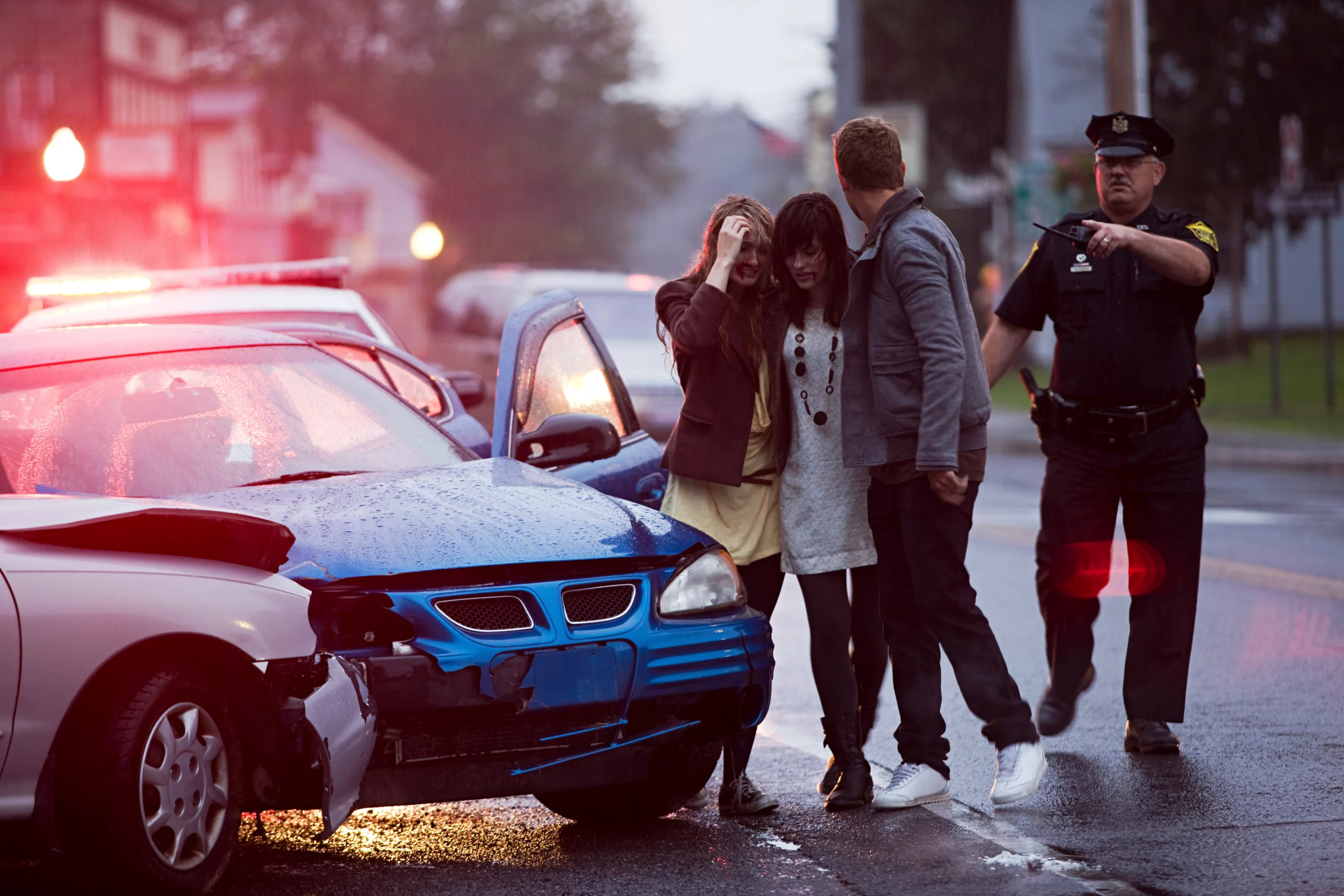 Distressed young adults involved in a car accident scenario, showing emotional stress and concern over injuries and damages, illustrating comparative negligence in New Jersey personal injury claims.